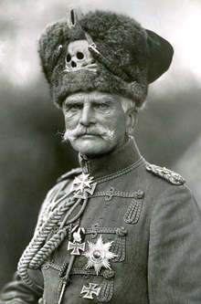 a hussar with a big silver skull badge on his hat