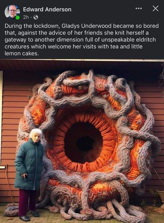 Gladys Underwood knitted a gateway to another dimension - in orange with grey tendrils. Object is represented as twice the height of an old lady.
